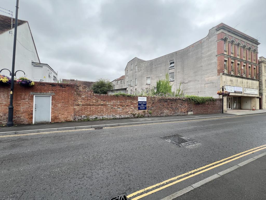 Lot: 100 - FORMER TRANSPORT YARD WITH POTENTIAL - View of the site from High Street